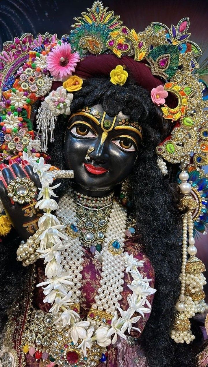 Krishna with flute and flower adornments