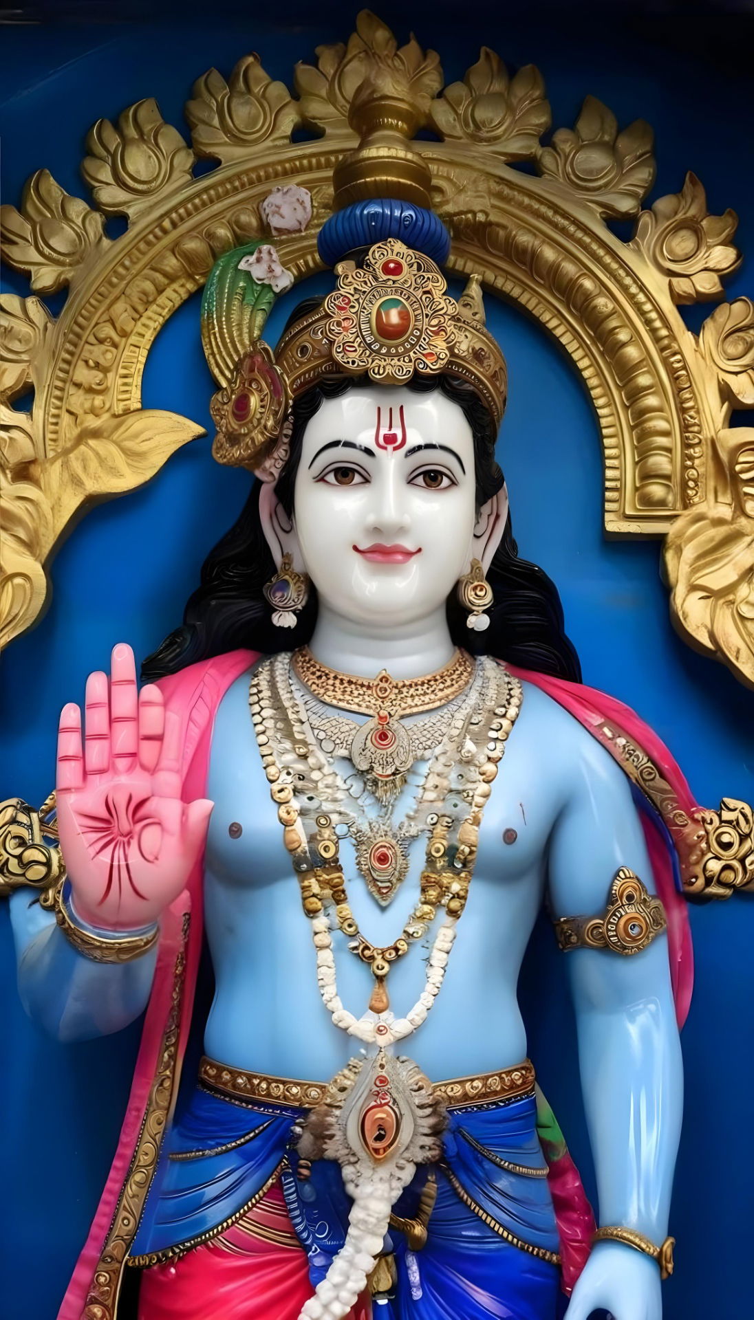 Serene blue Krishna marble statue.