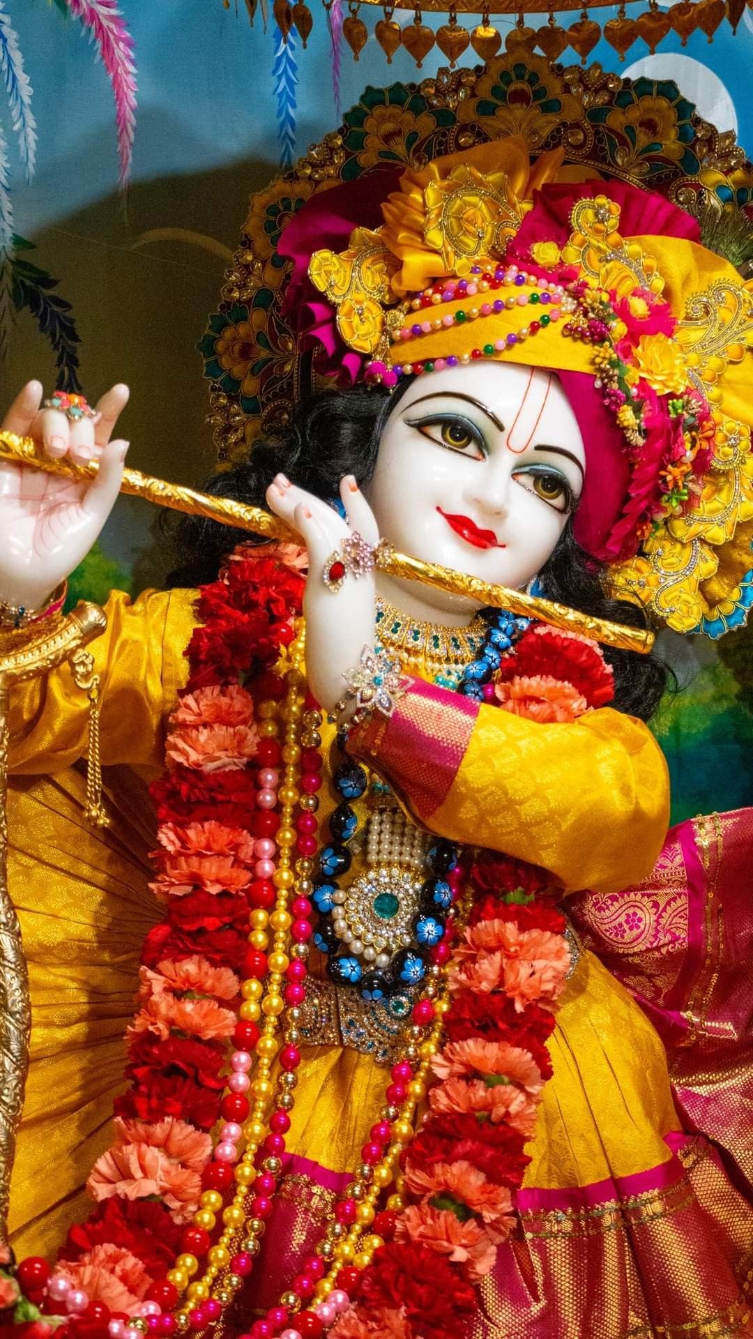 Krishna playing a melodious flute.
