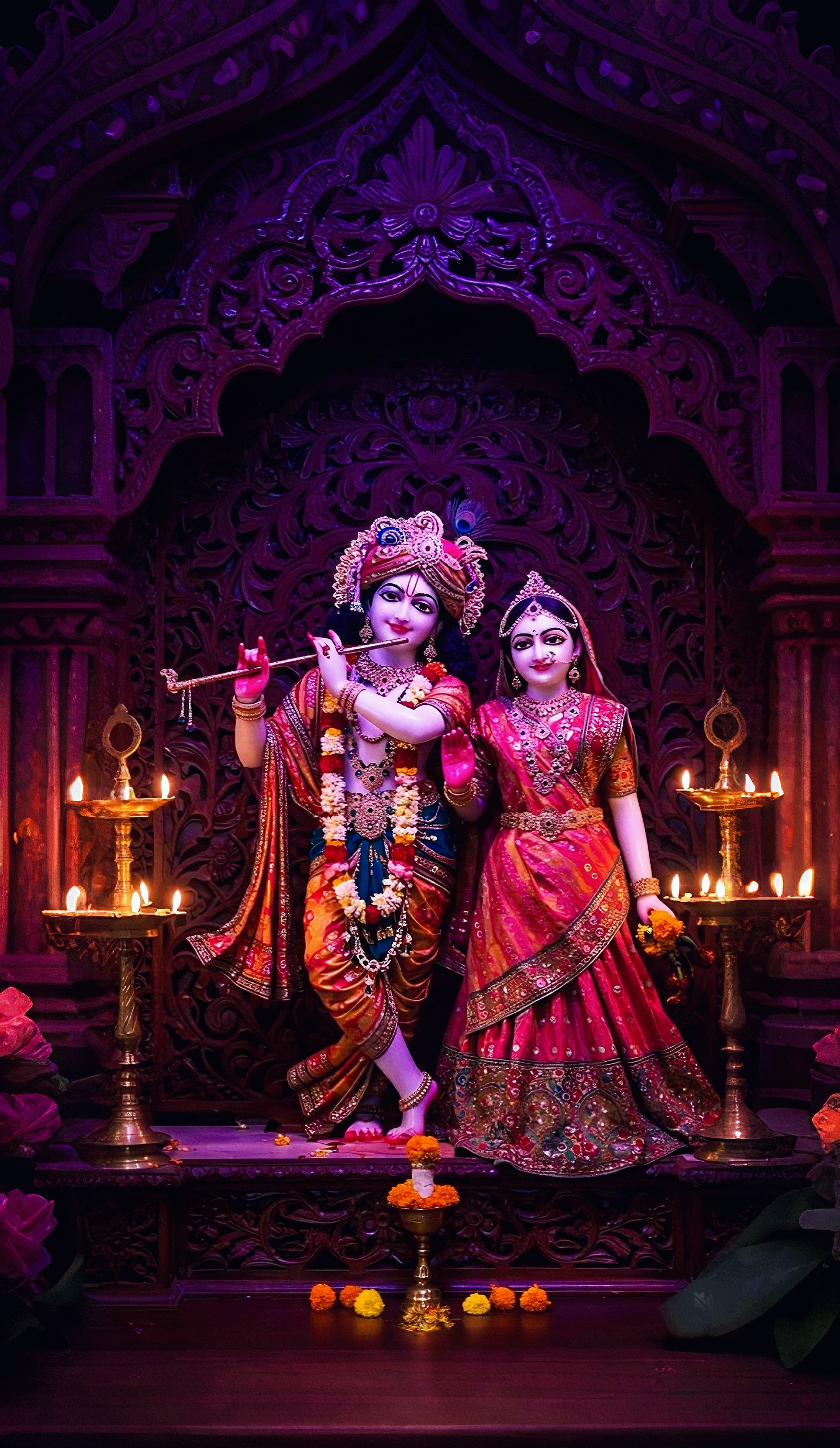 Radha Krishna temple deities with lamps