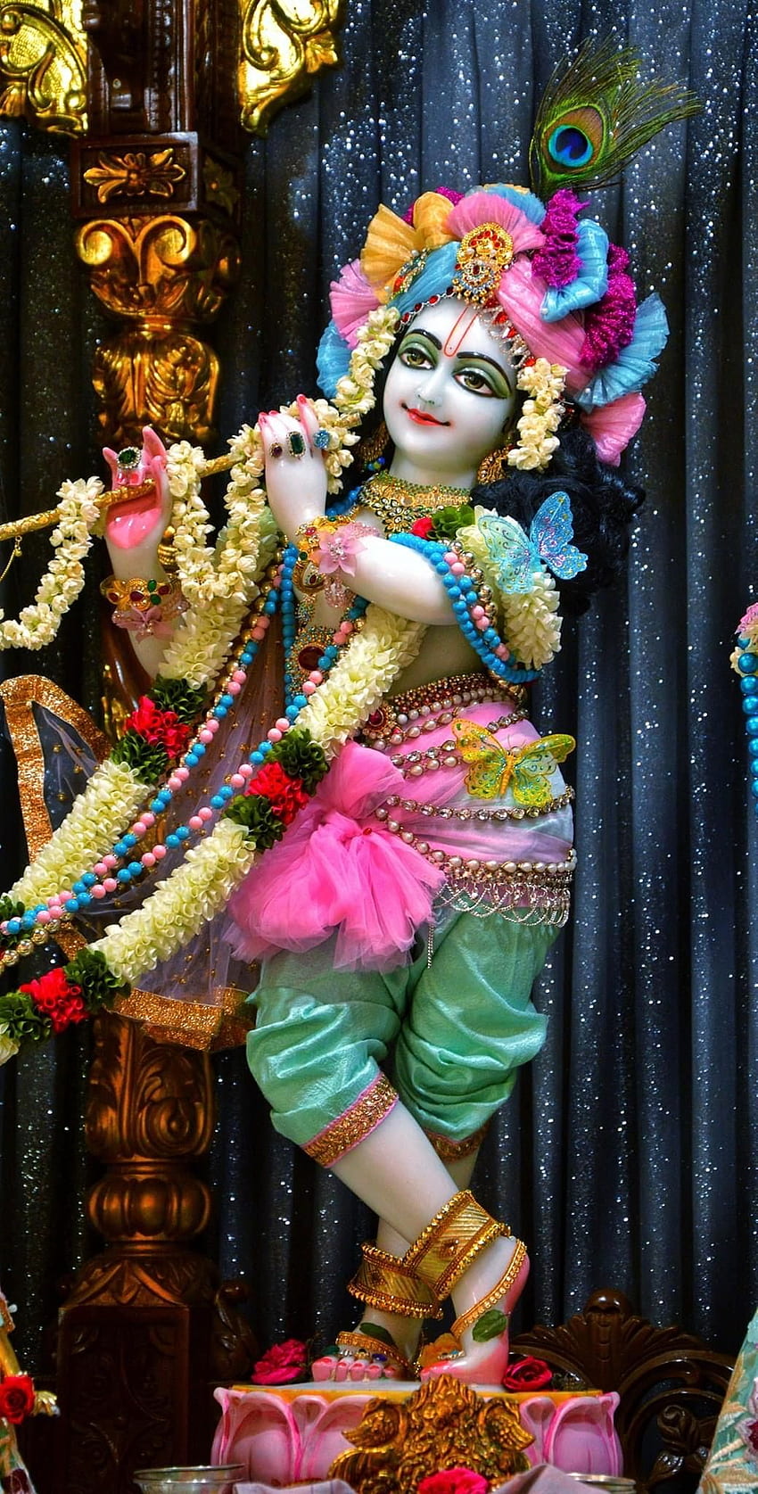 Lord Krishna playing flute with flowers