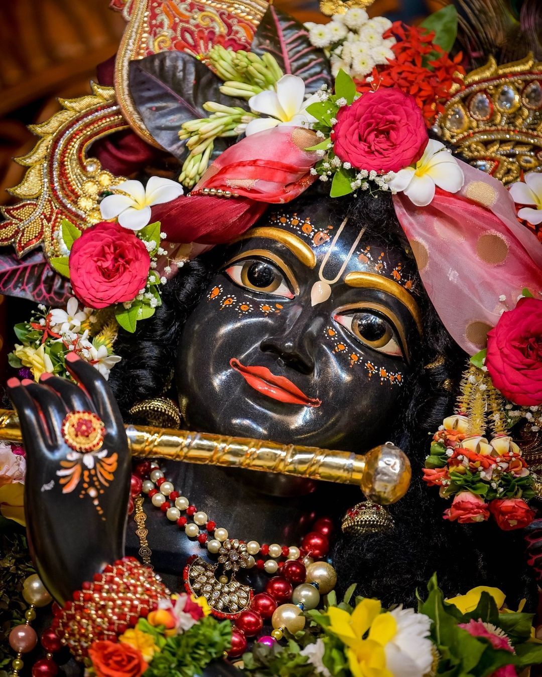 Krishna with flute and flower garland