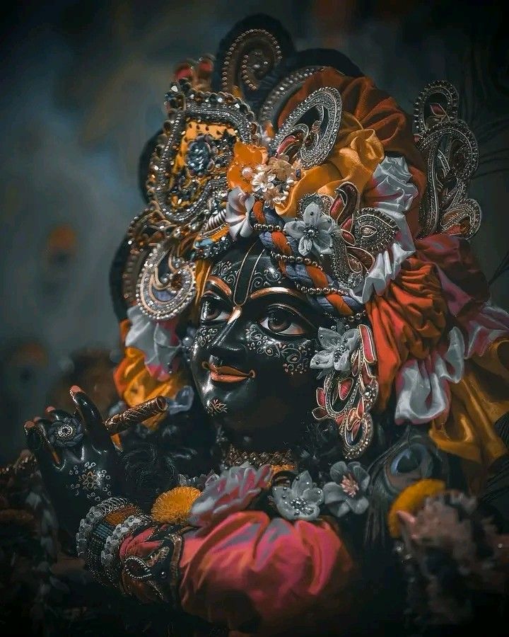 Krishna adorned with flowers and jewels