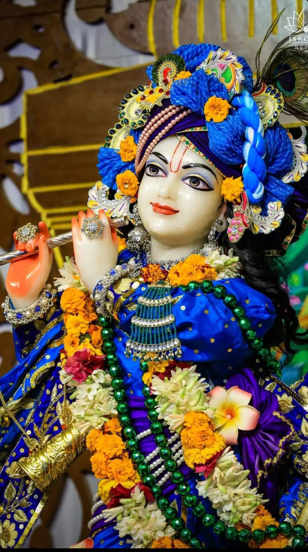 Lord Krishna with flute and flowers