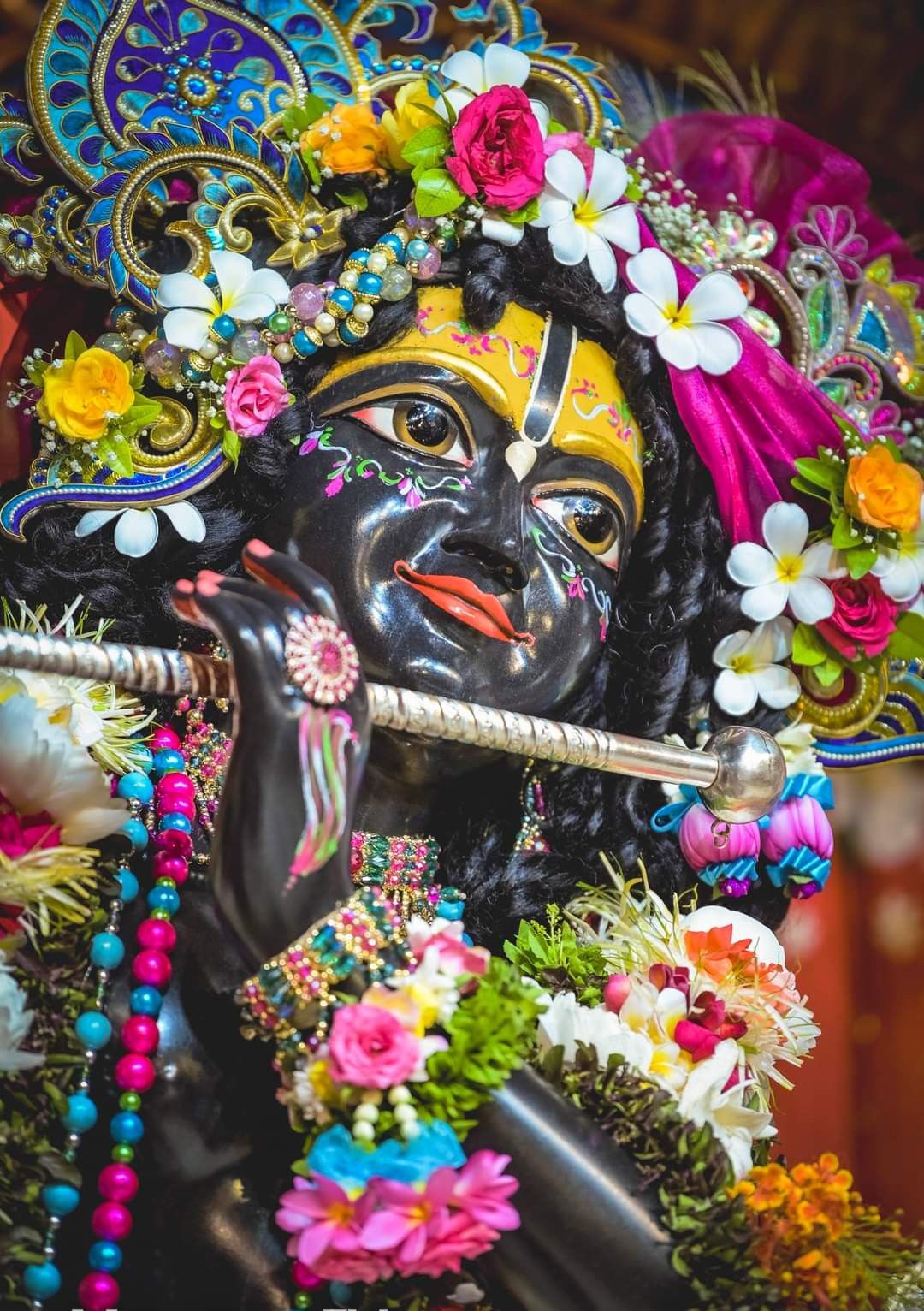 Krishna with flute and flower garland