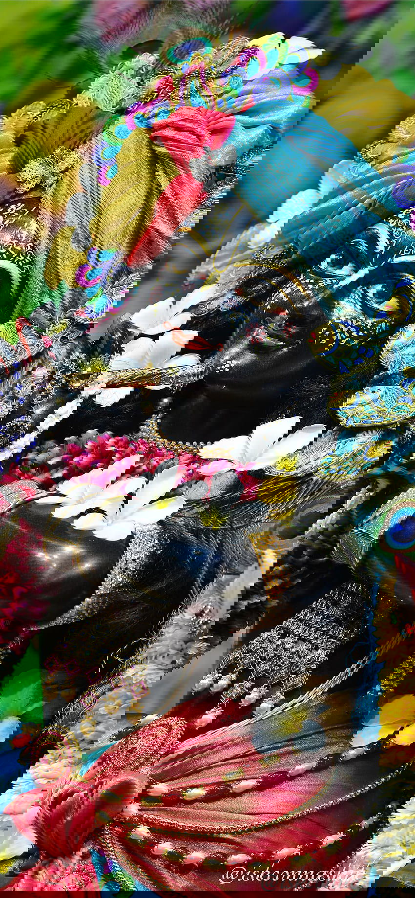 Krishna with flute and floral adornments