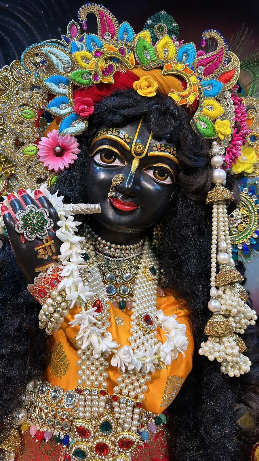 Lord Krishna with floral decorations