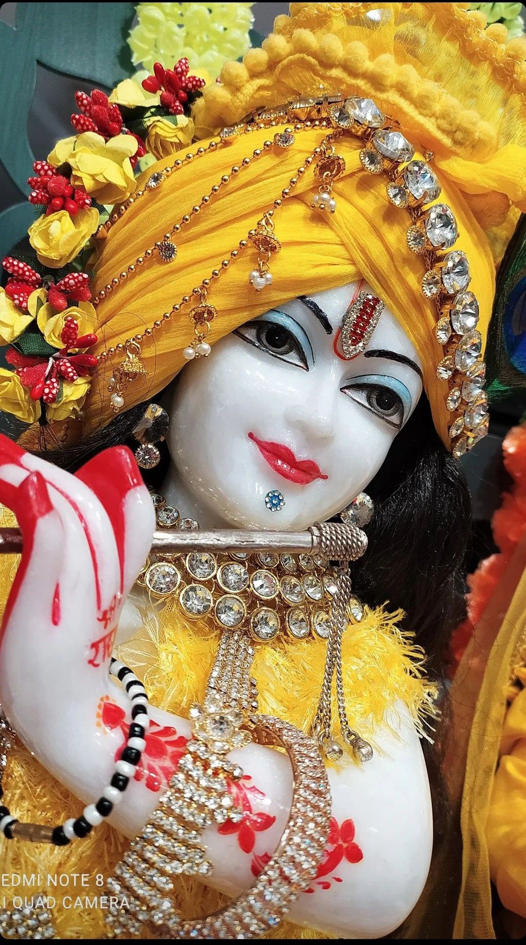 Lord Krishna with flute and peacock feather