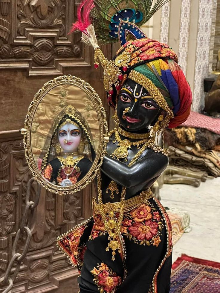 Krishna admiring his reflection in a mirror