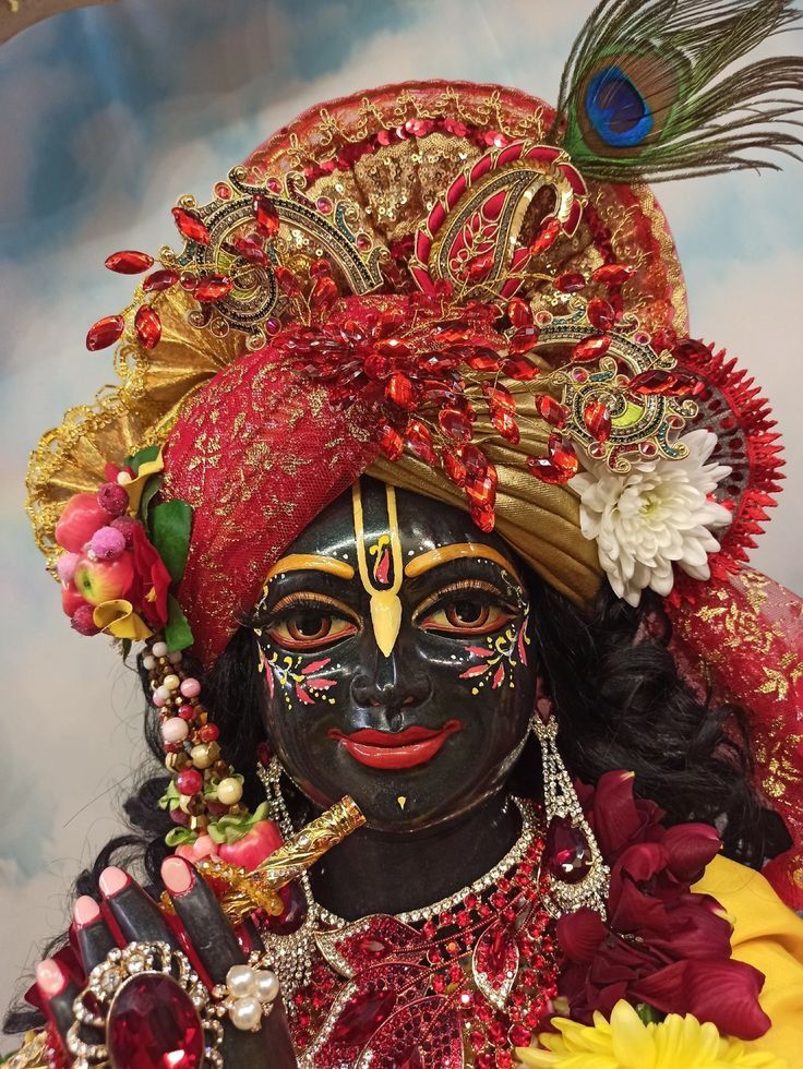Krishna adorned with peacock feather and flowers