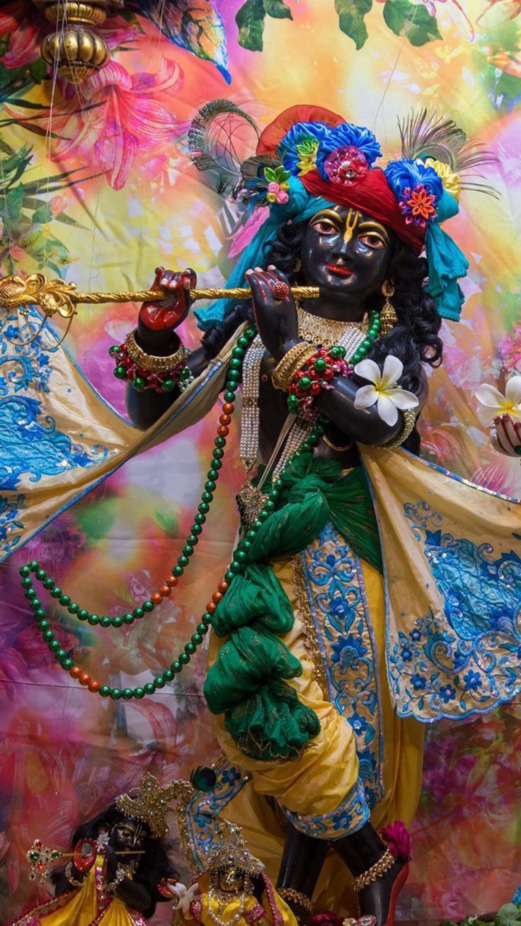 Lord Krishna playing the flute beautifully.