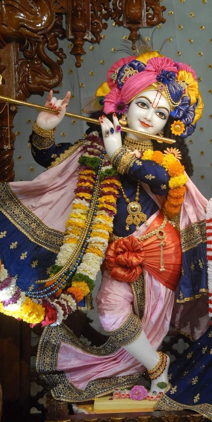 Lord Krishna playing a flute statue