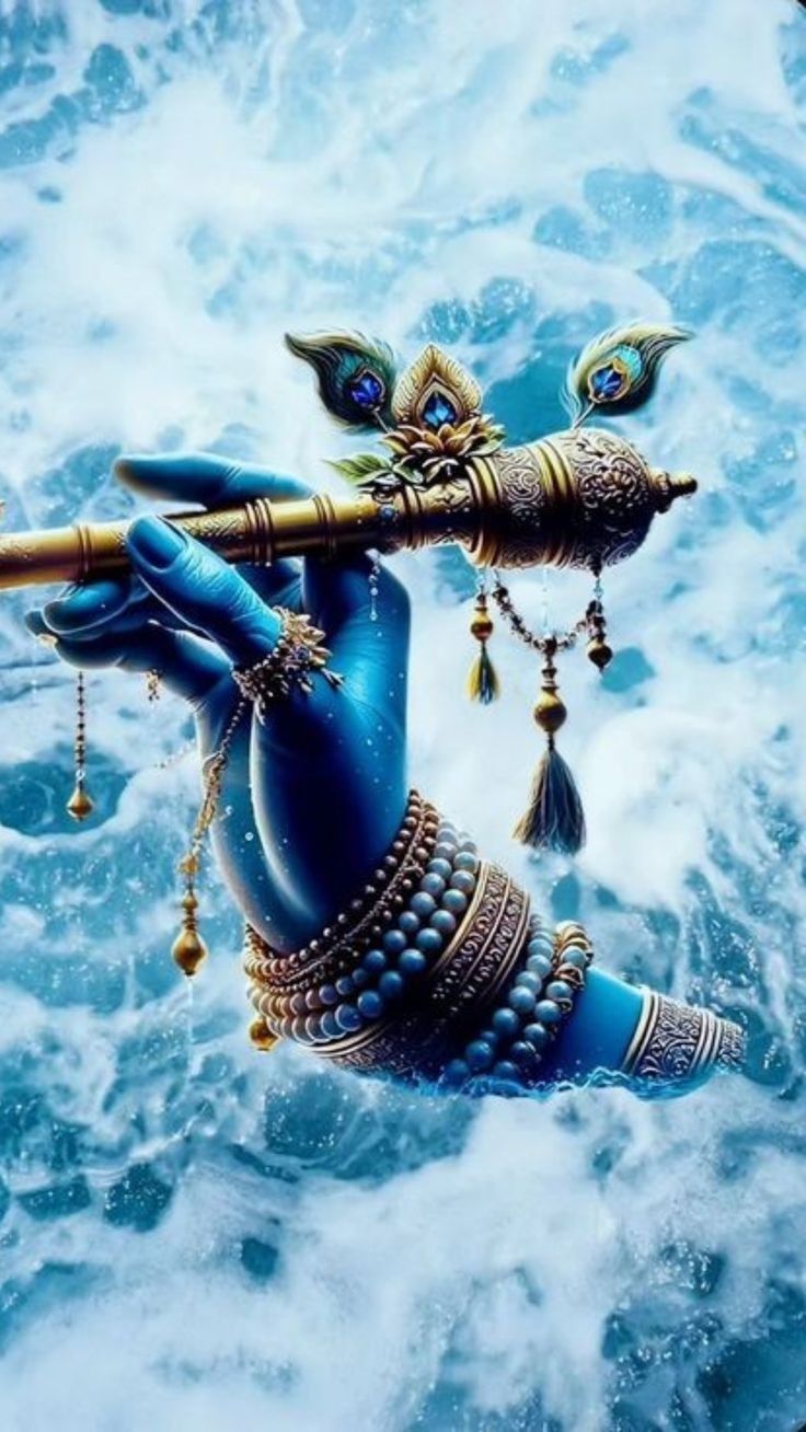 Krishna\'s hand playing the flute.