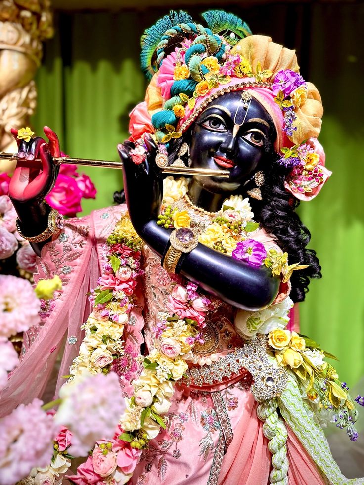 Krishna playing flute with peacock feather