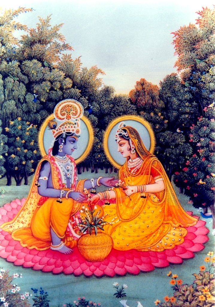 Radha Krishna sharing a lotus blossom.