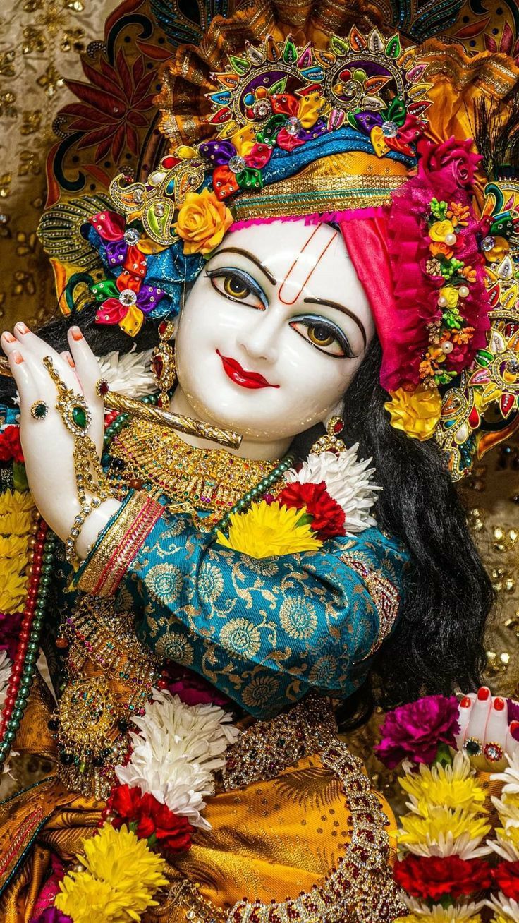 Krishna with peacock feather and flowers