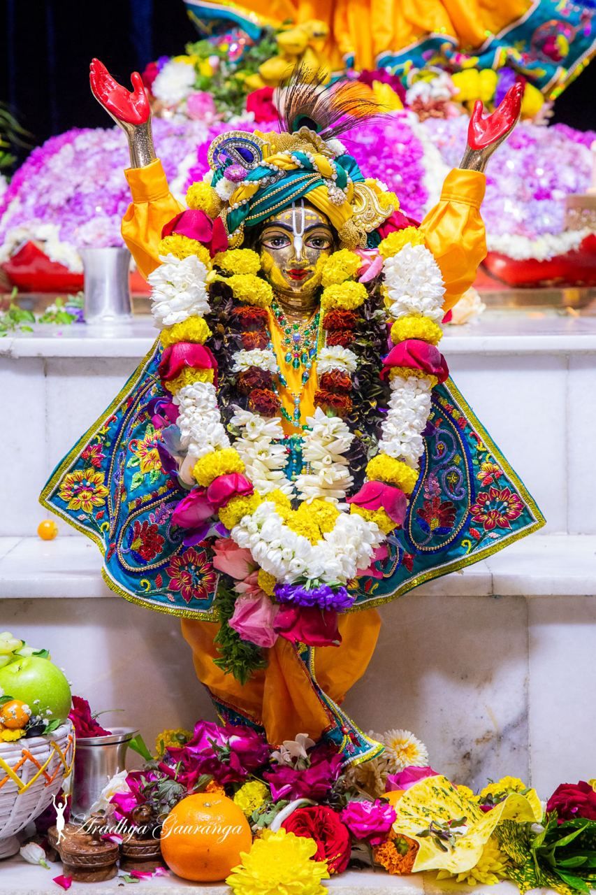Krishna idol adorned with flowers
