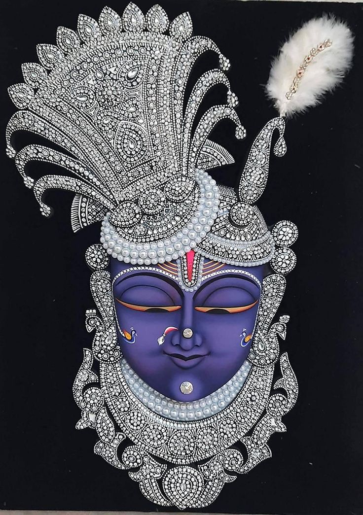 Jeweled Krishna face with peacock feather