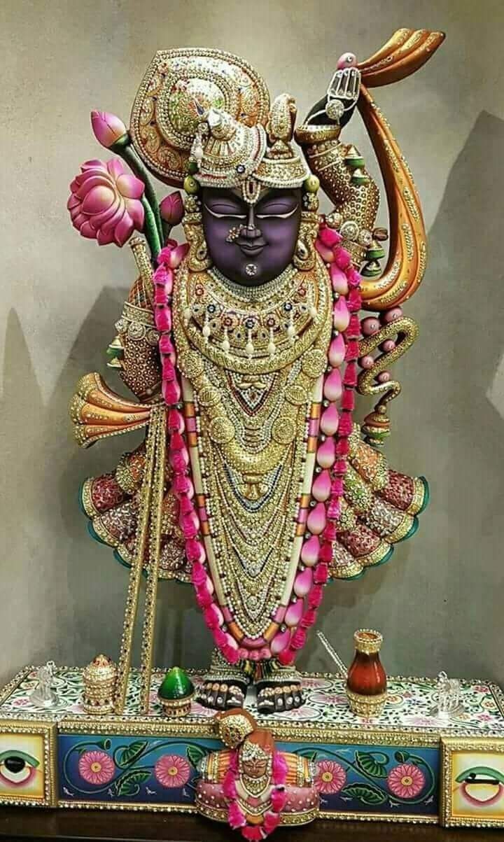 Shrinathji adorned in golden jewelry.