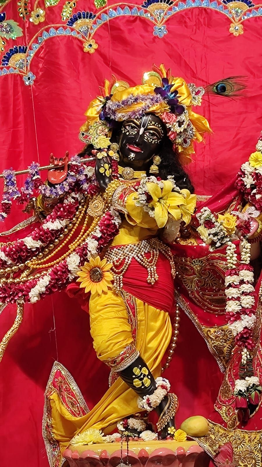 Krishna idol with floral decorations