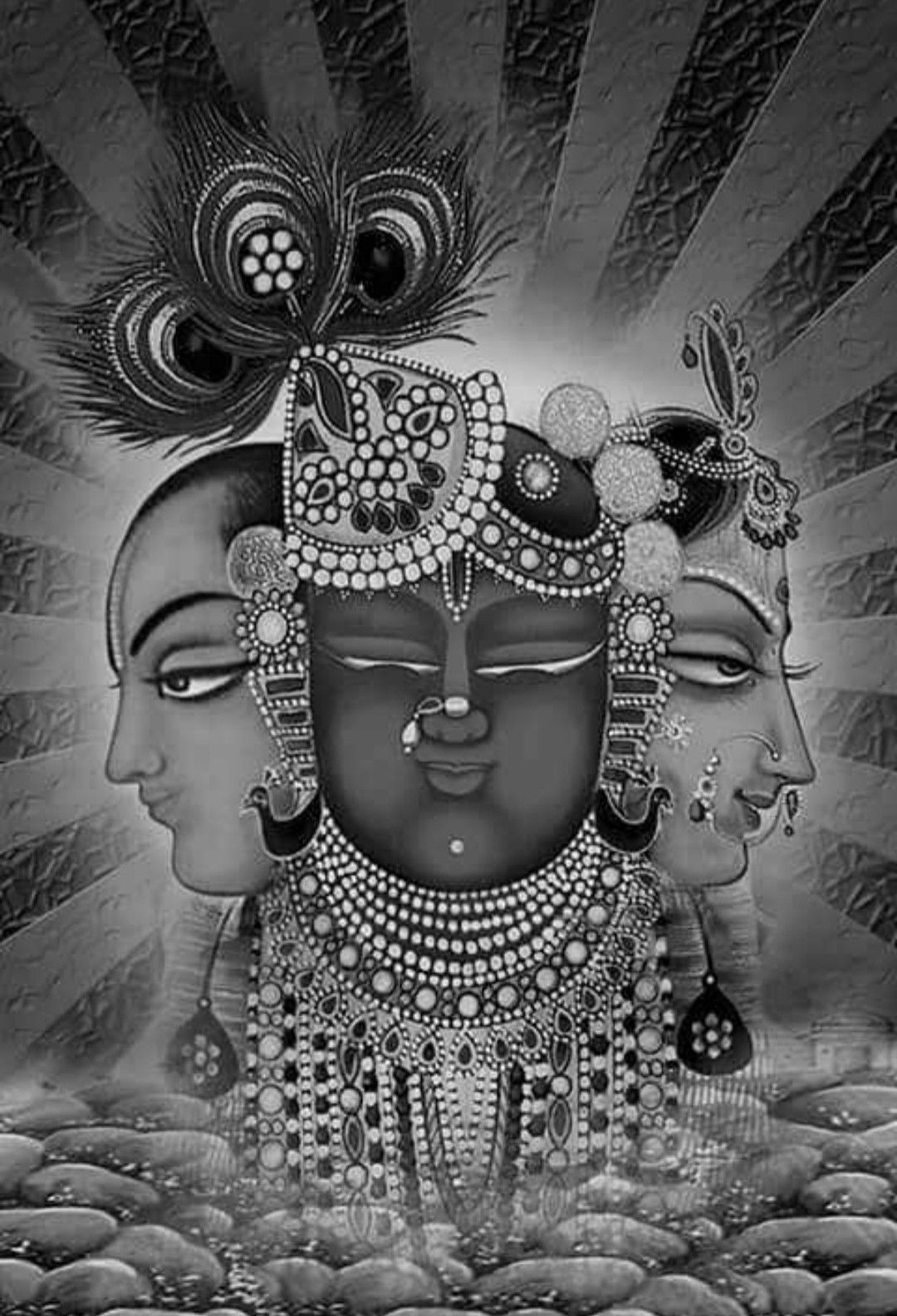 Triple-faced Krishna with peacock feather