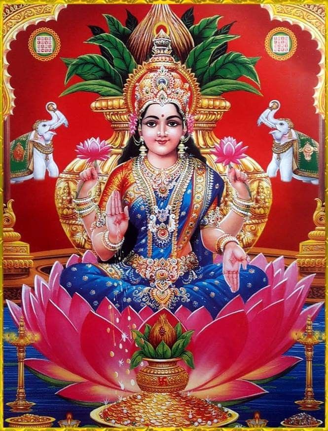 Lakshmi Maa seated on a lotus flower.