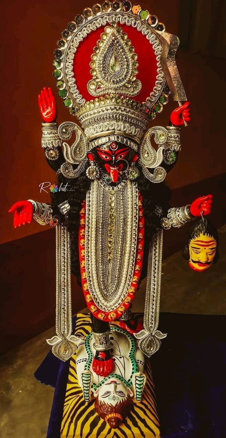 Fierce Mahakali Maa idol with red hues