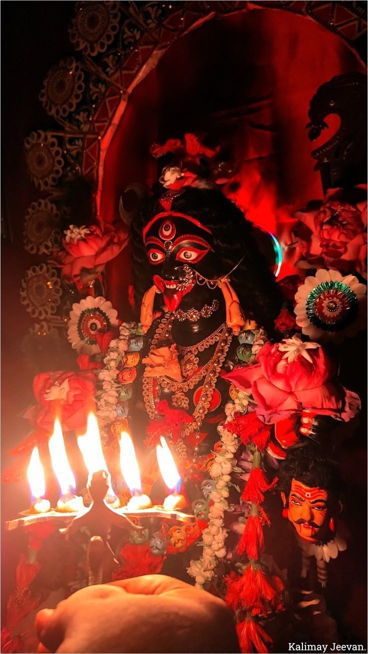 Mahakali Maa with candles and flowers