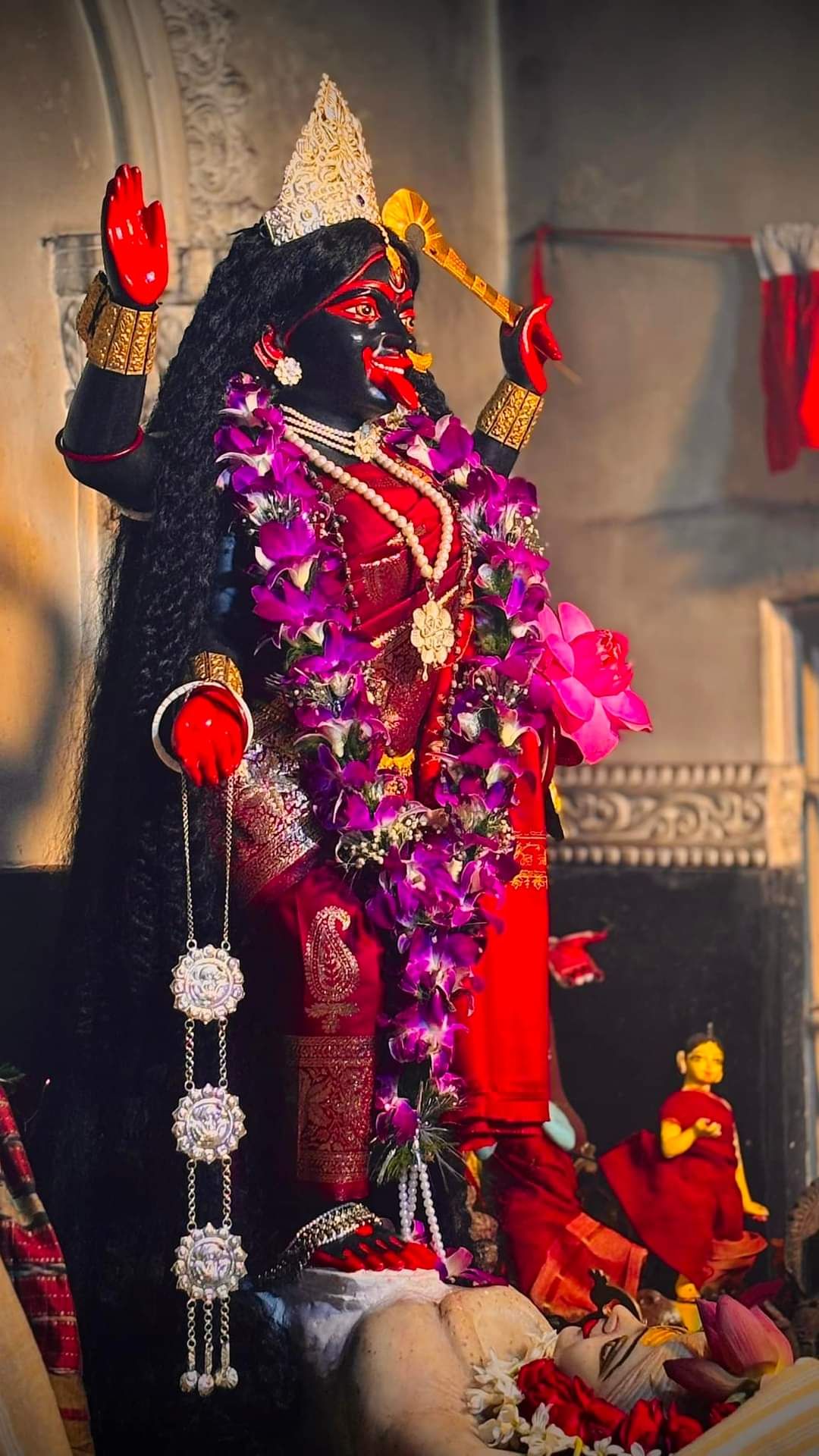 Maa Kali adorned with flowers and jewelry