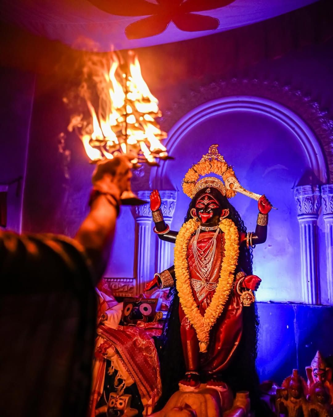 Mahakali Maa with flames and ritual.
