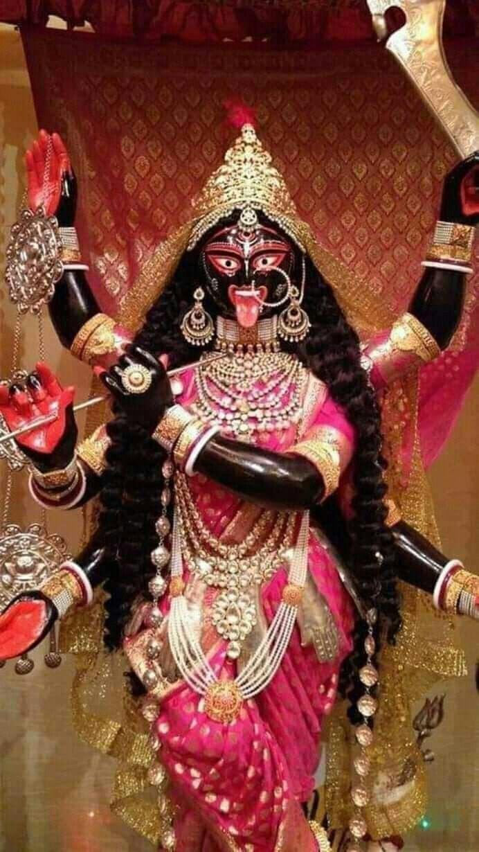 Mahakali Maa portrait with red background.