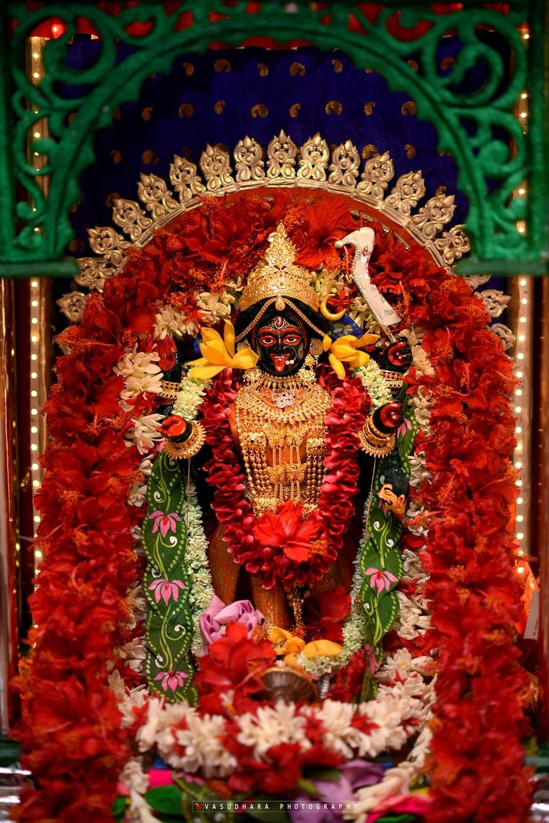 Maa Kali with floral background.