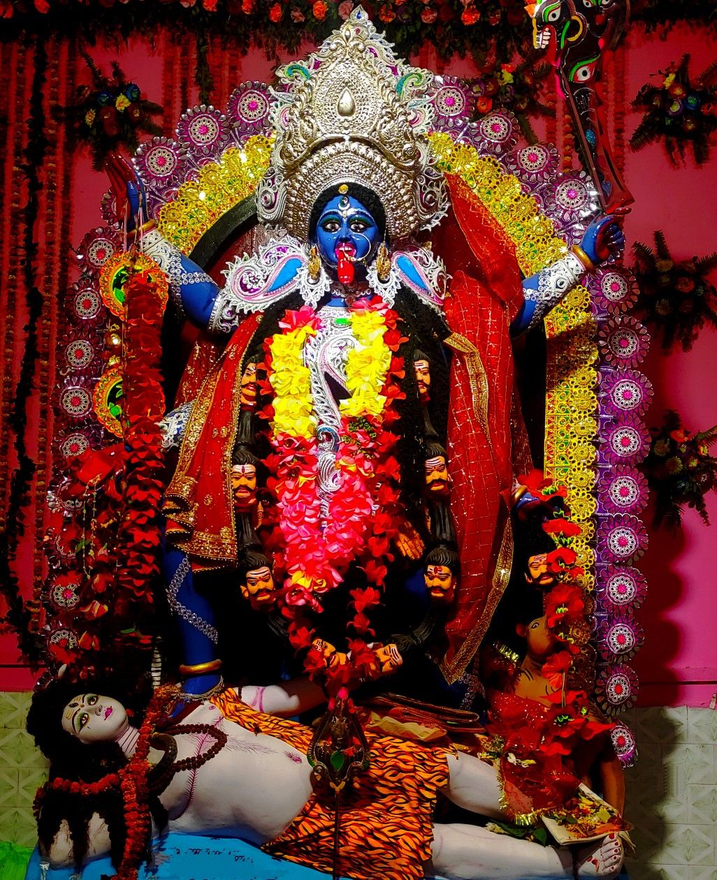 Mahakali Maa idol with floral garland.