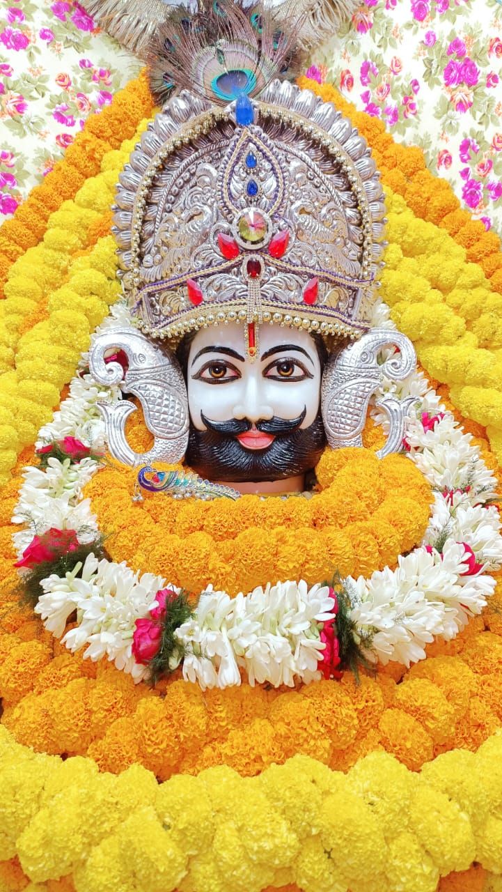 Close-up of Ramdevpir with flower garland