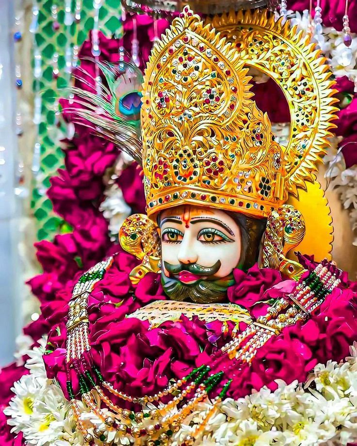 Close-up of Ramdevpir with floral crown