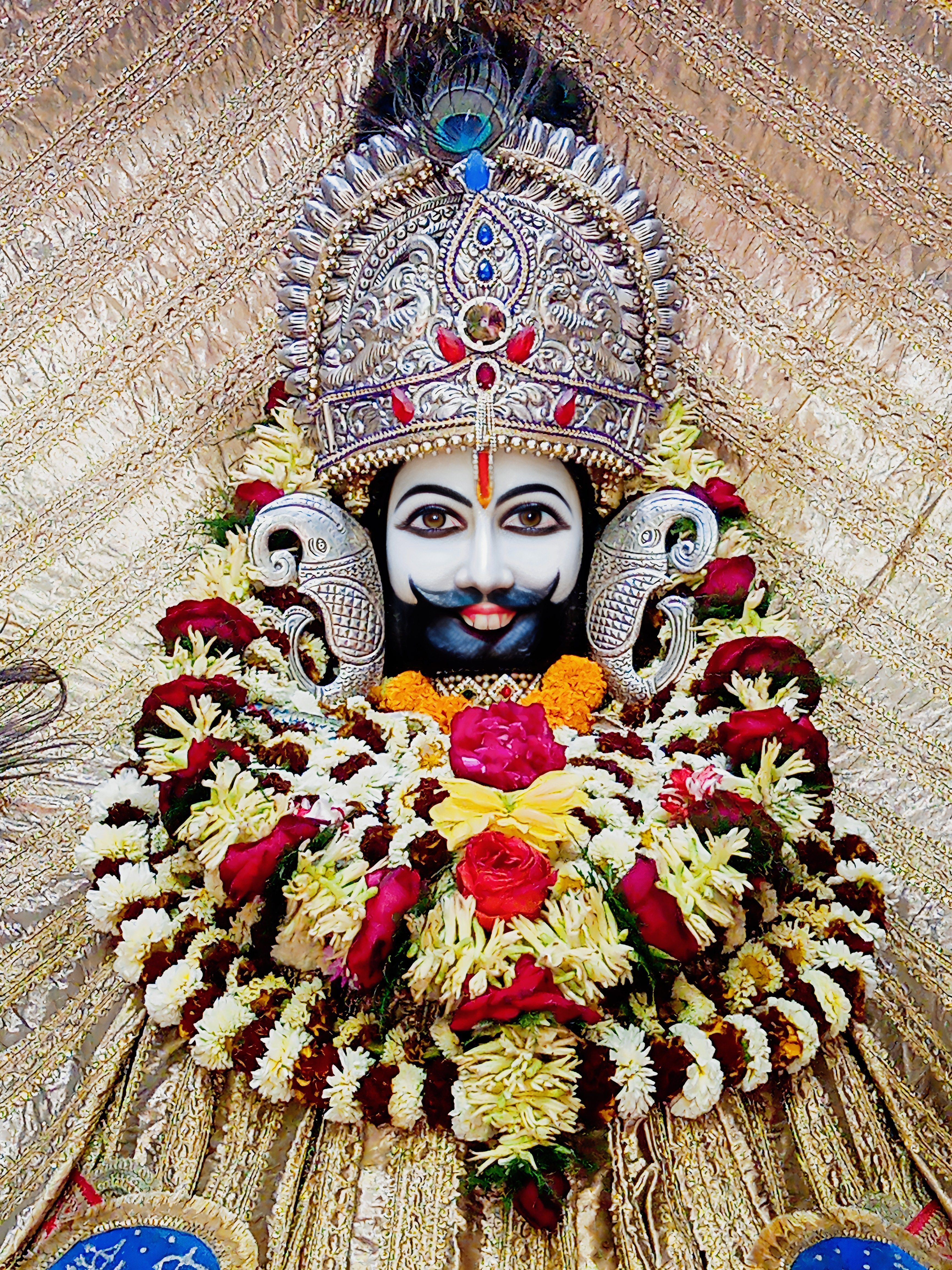 Ramdevpir adorned with floral garland