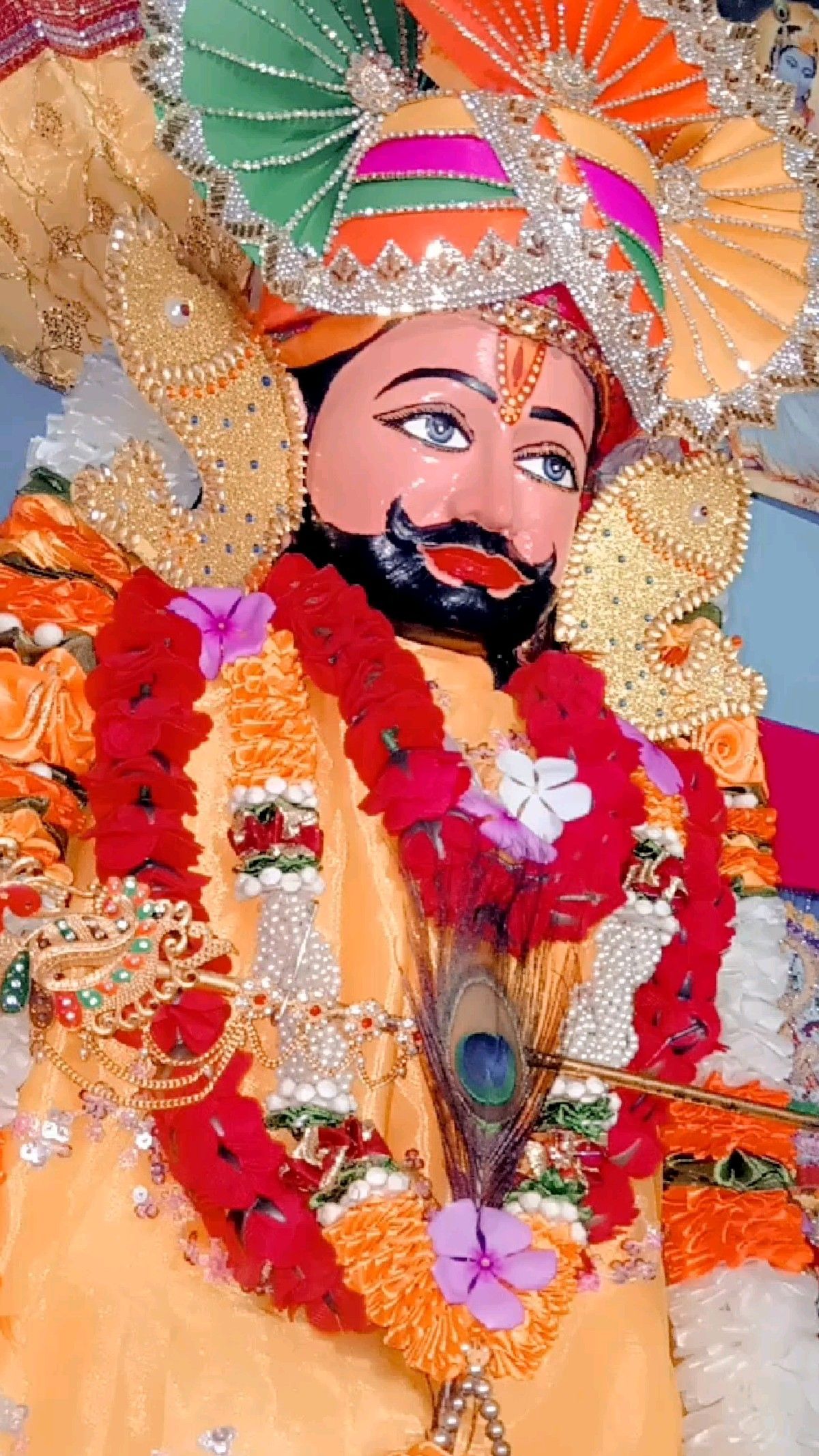 Close-up of Ramdevpir’s radiant face.