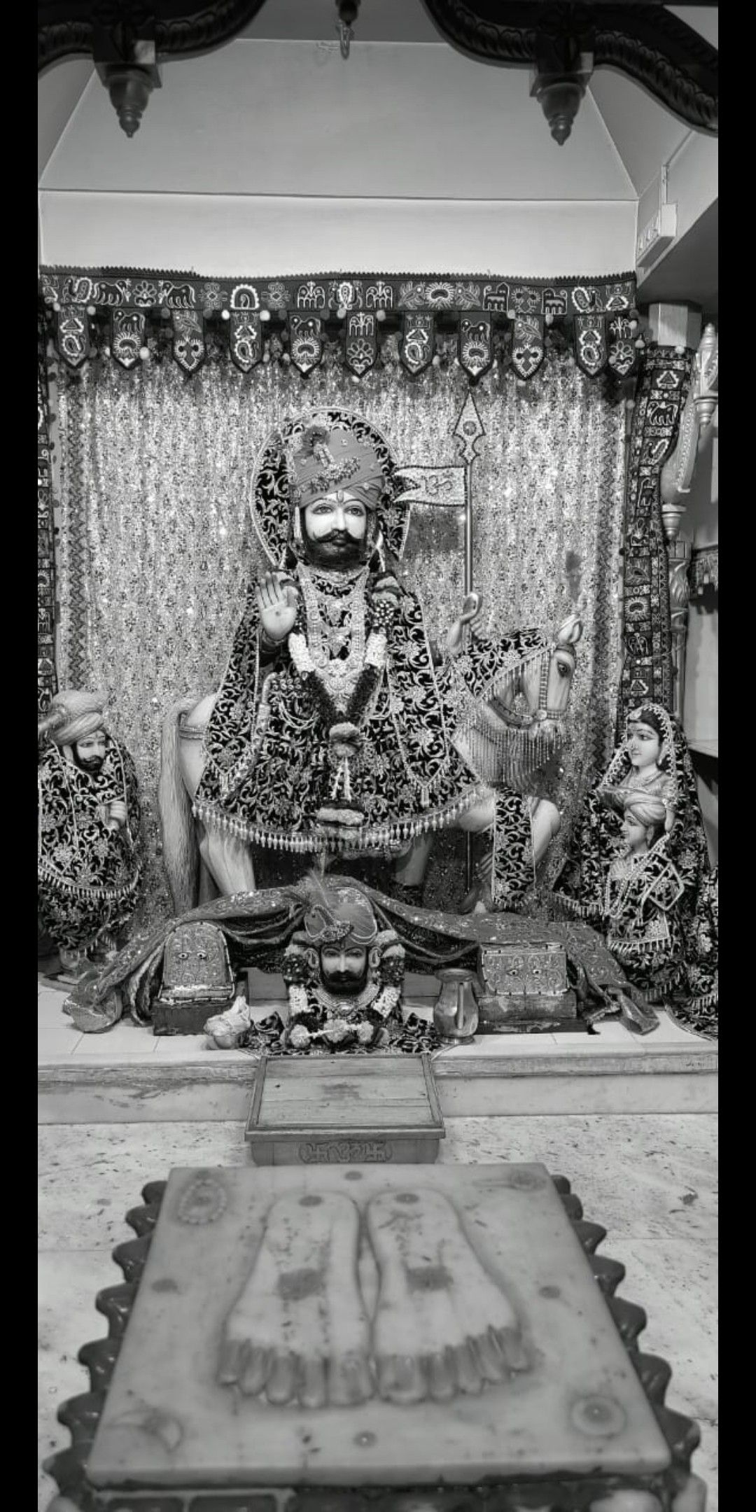 Ramdevpir seated on a throne