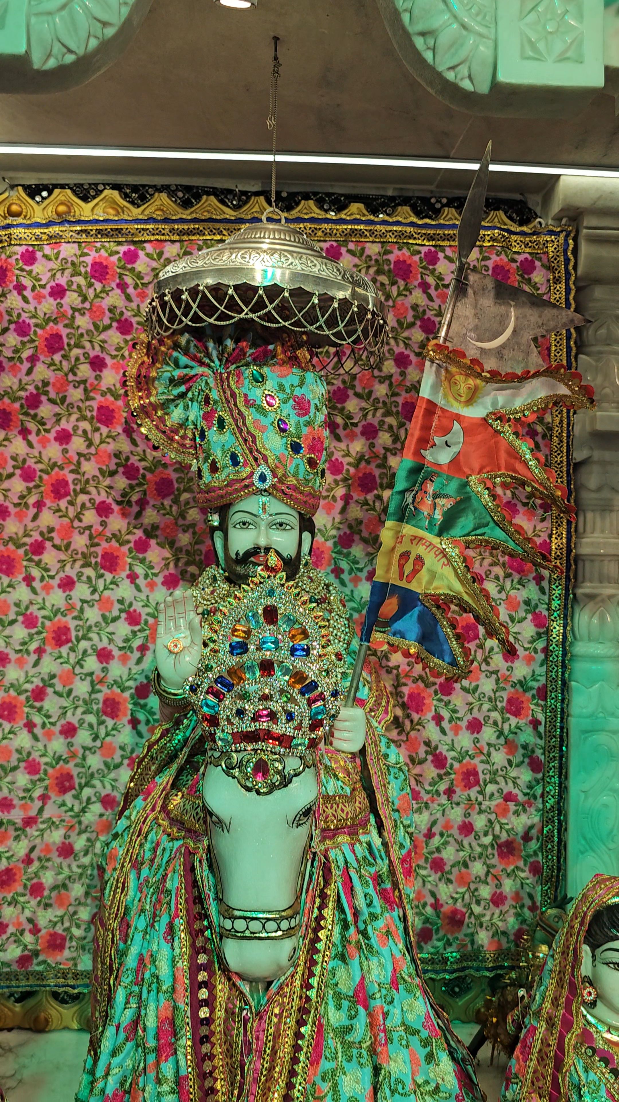 Ramdevpir in ornate temple setting