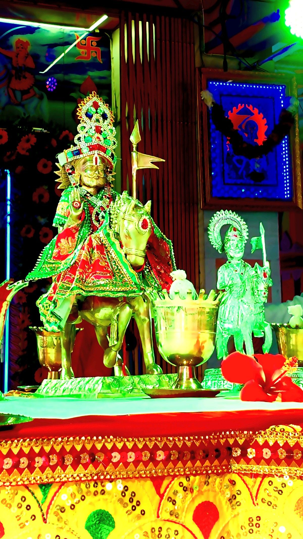 Ramdevpir riding a horse, vibrant temple