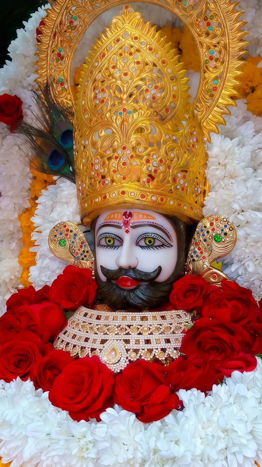 Close-up of Ramdevpir with floral garland
