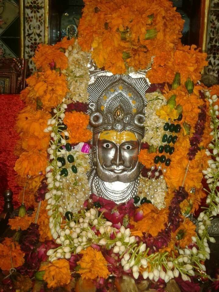 Ramdevpir adorned with floral garland