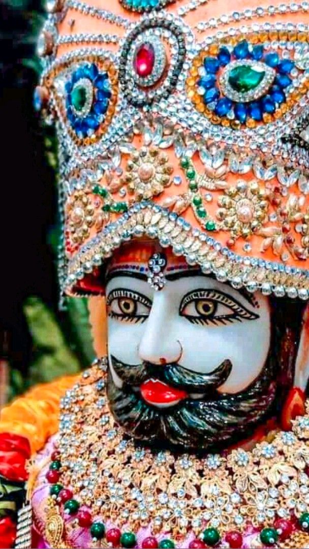 Close-up of Ramdevpir with jeweled headgear