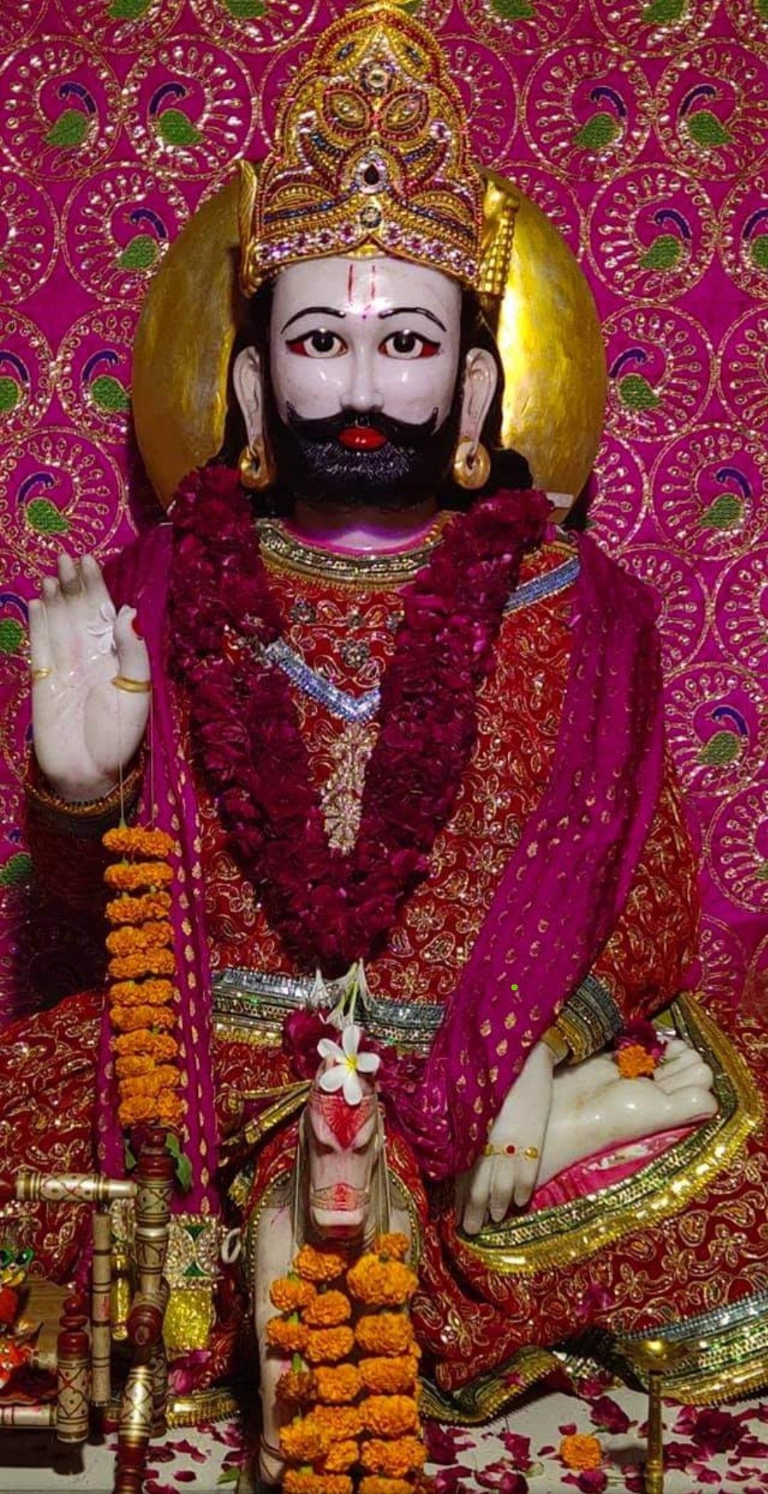 Baba Ramdevpir idol with flower garland