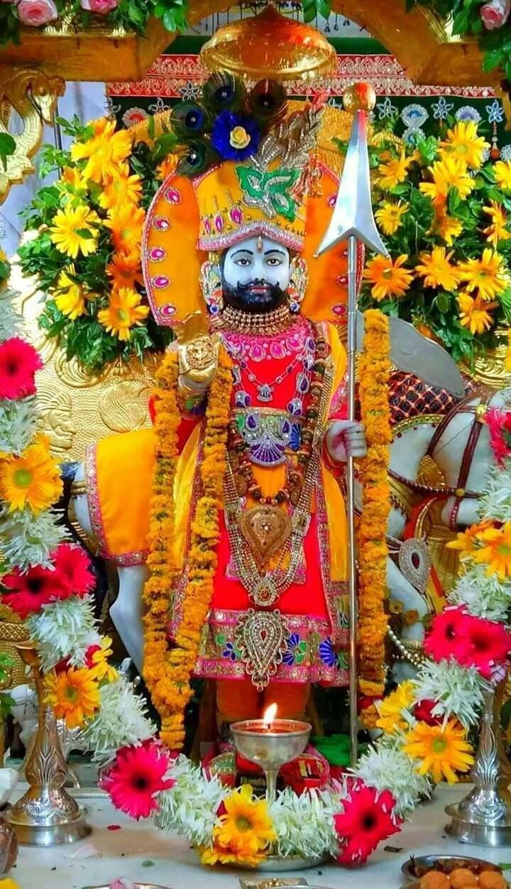 Ramdevpir adorned with flowers and grace