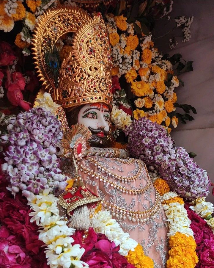 Ramdevpir adorned with flowers and crown