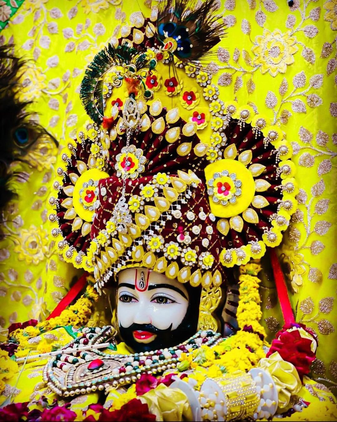 Ramdevpir adorned with floral crown.