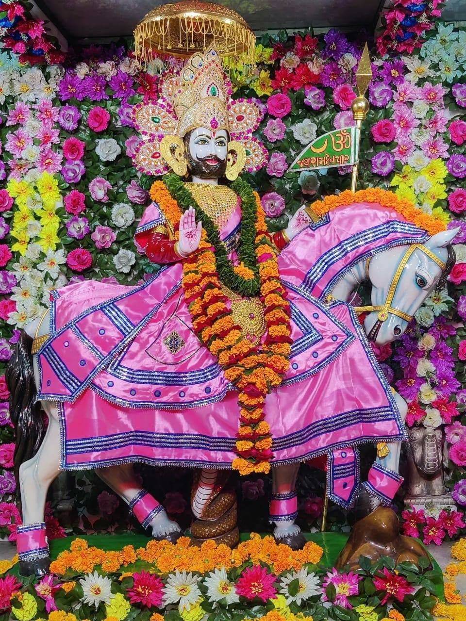 Ramdevpir riding a horse adorned with flowers