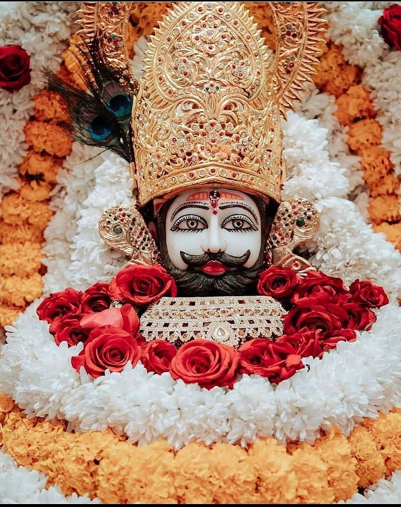 Ramdevpir with floral garland and gold crown