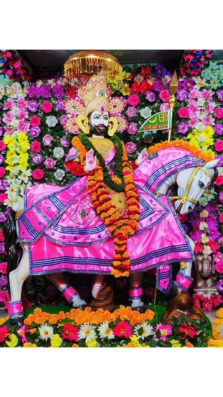 Ramdevpir riding a horse with flowers